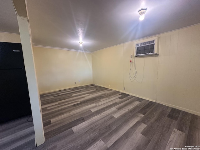 407 Westminster Ave, San Antonio, TX 78228 - finished below grade area featuring freestanding refrigerator, wood finished floors, a wall unit AC, and baseboards