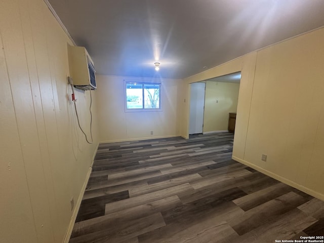 407 Westminster Ave, San Antonio, TX 78228 - spare room featuring dark wood-style flooring, baseboards, and a wall unit AC