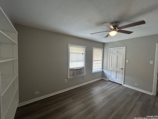 407 Westminster Ave, San Antonio, TX 78228 - unfurnished bedroom featuring dark wood-style flooring, cooling unit, baseboards, and a ceiling fan