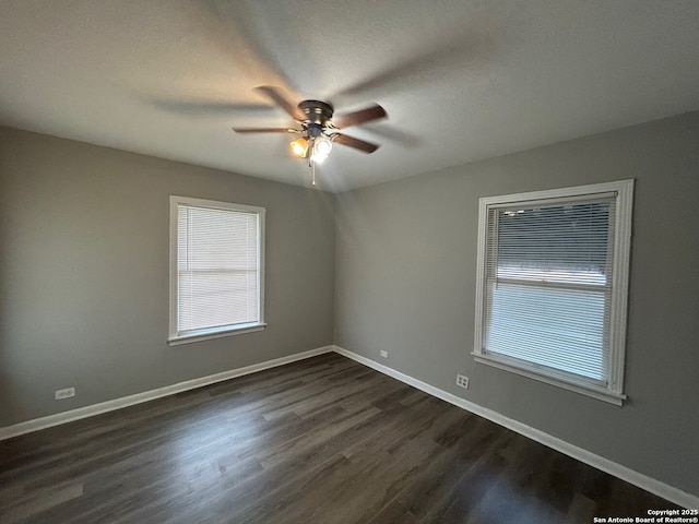 407 Westminster Ave, San Antonio, TX 78228 - unfurnished room featuring a ceiling fan, plenty of natural light, dark wood finished floors, and baseboards