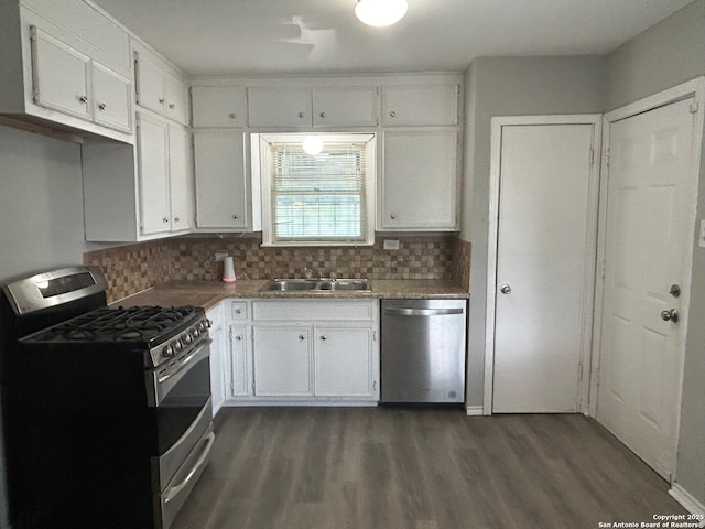 407 Westminster Ave, San Antonio, TX 78228 - kitchen with stainless steel appliances, dark wood-type flooring, and white cabinetry