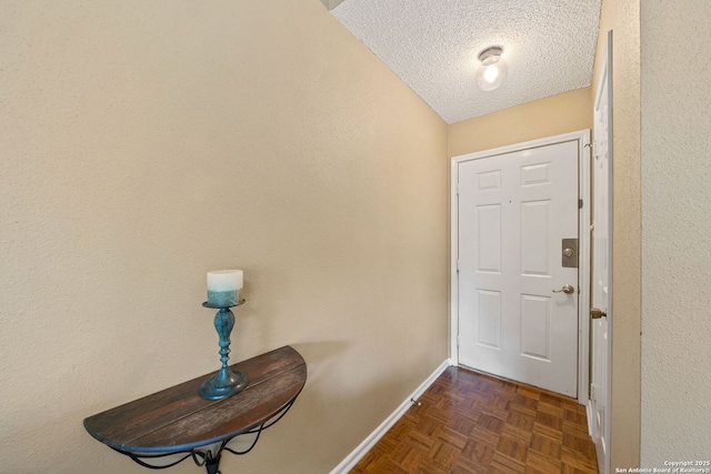 10955 Wurzbach Unit 905, San Antonio, TX 78230 - doorway to outside with a textured ceiling and baseboards