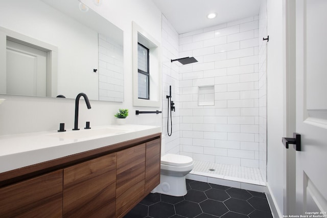 321 Porter St, San Antonio, TX 78210 - bathroom with toilet, vanity, tiled shower, tile patterned floors, and recessed lighting