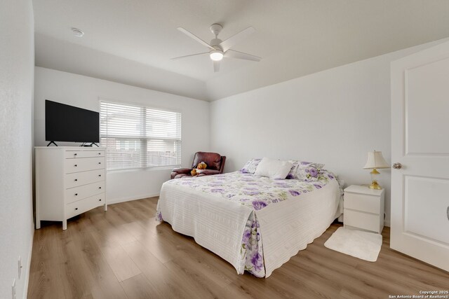 6022 Akin Pl, San Antonio, TX 78261 - bedroom featuring wood finished floors, a ceiling fan, and baseboards