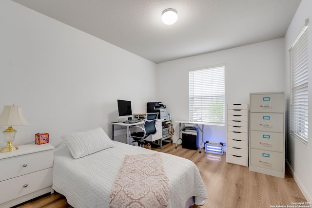 6022 Akin Pl, San Antonio, TX 78261 - bedroom featuring light wood-style floors and an office area