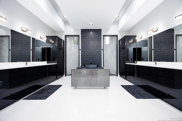 25003 Miranda Rdg, Boerne, TX 78006 - full bathroom featuring two vanities, a garden tub, and a shower
