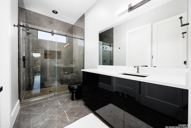 25003 Miranda Rdg, Boerne, TX 78006 - bathroom featuring a stall shower, vanity, marble finish flooring, and toilet