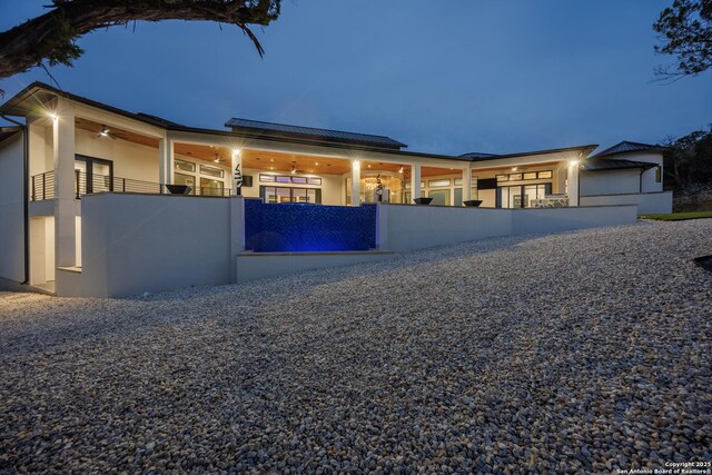 25003 Miranda Rdg, Boerne, TX 78006 - view of front facade featuring roof mounted solar panels, a ceiling fan, and stucco siding