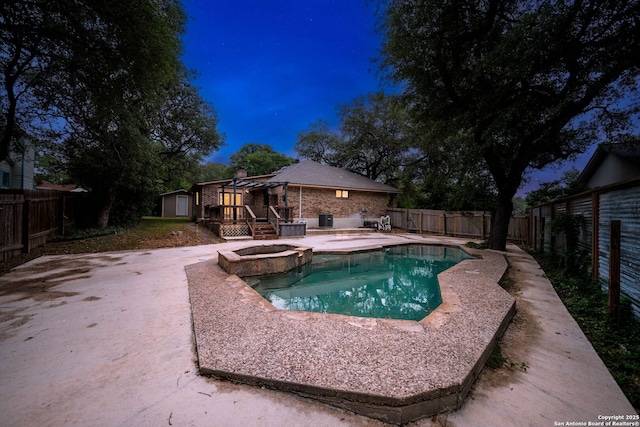 19739 Encino Way, San Antonio, TX 78259 - view of pool with a fenced backyard, a patio area, a deck, and a pool with connected hot tub