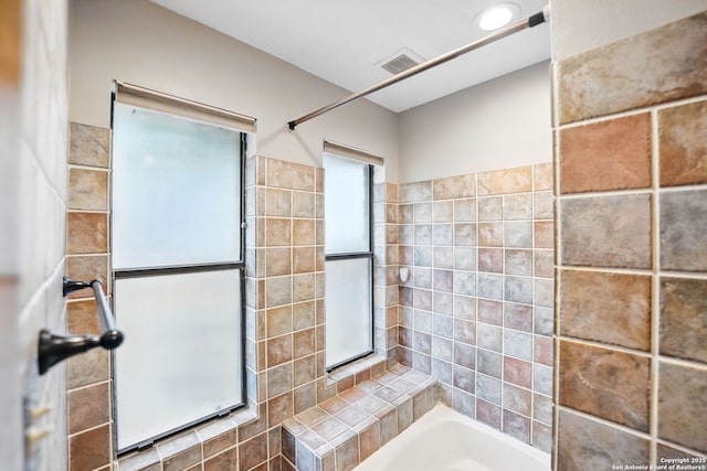 19739 Encino Way, San Antonio, TX 78259 - bathroom with tub / shower combination and tile walls