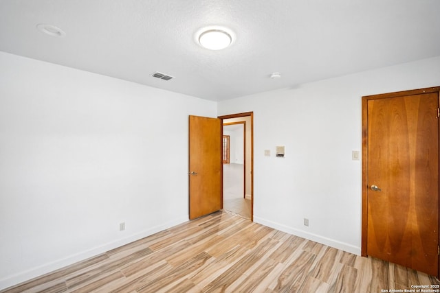 19739 Encino Way, San Antonio, TX 78259 - unfurnished bedroom with light wood-type flooring and baseboards