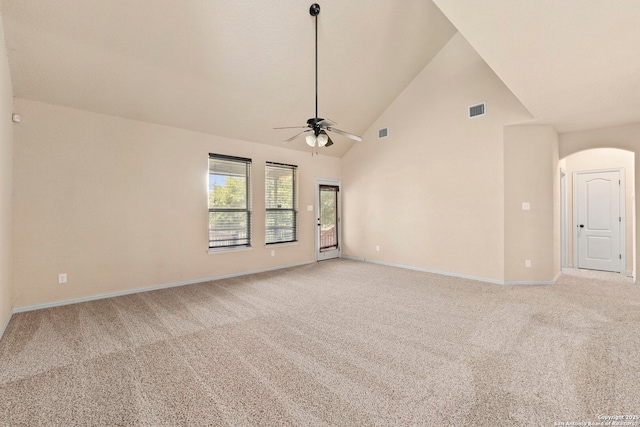 6031 Diego, San Antonio, TX 78253 - empty room featuring light carpet, ceiling fan, arched walkways, high vaulted ceiling, and baseboards