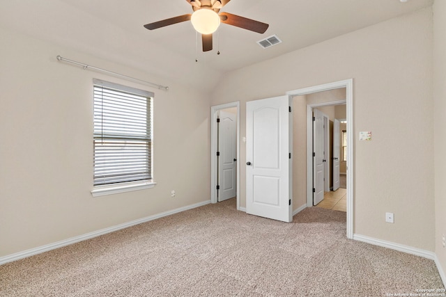 6031 Diego, San Antonio, TX 78253 - unfurnished bedroom featuring light colored carpet, baseboards, vaulted ceiling, and ceiling fan