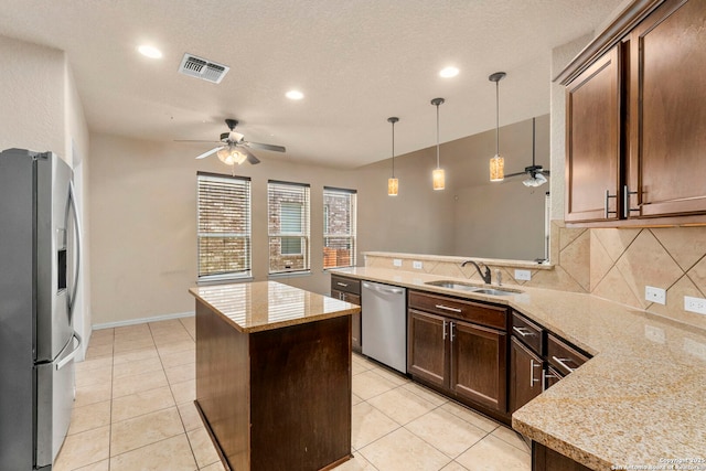 6031 Diego, San Antonio, TX 78253 - kitchen with appliances with stainless steel finishes, a sink, a ceiling fan, a peninsula, and recessed lighting