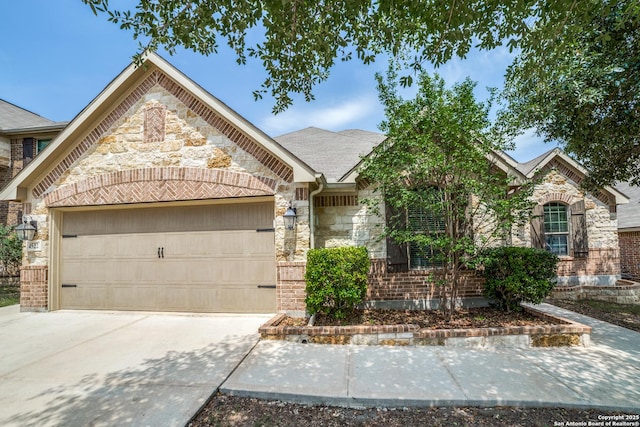 4522 Amos Pollard, San Antonio, TX 78253 - view of front of property with an attached garage, stone siding, driveway, and brick siding