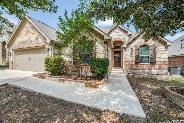 4522 Amos Pollard, San Antonio, TX 78253 - french provincial home featuring stone siding, a garage, driveway, and cooling unit