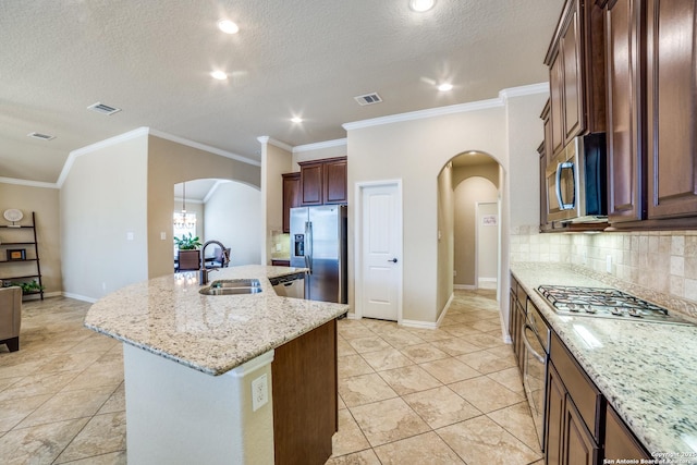 4522 Amos Pollard, San Antonio, TX 78253 - kitchen featuring arched walkways, appliances with stainless steel finishes, a sink, tasteful backsplash, and a textured ceiling