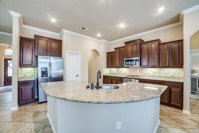 4522 Amos Pollard, San Antonio, TX 78253 - kitchen featuring appliances with stainless steel finishes, a sink, arched walkways, tasteful backsplash, and crown molding