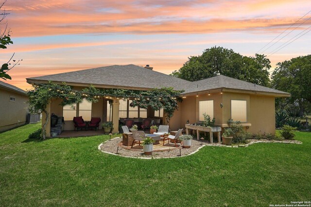 2756 Indian Wls, Kerrville, TX 78028 - rear view of property featuring a patio, stucco siding, and a lawn