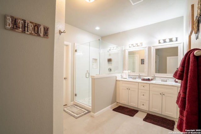 239 Damar Cv, Canyon Lake, TX 78133 - bathroom with double vanity and a shower stall
