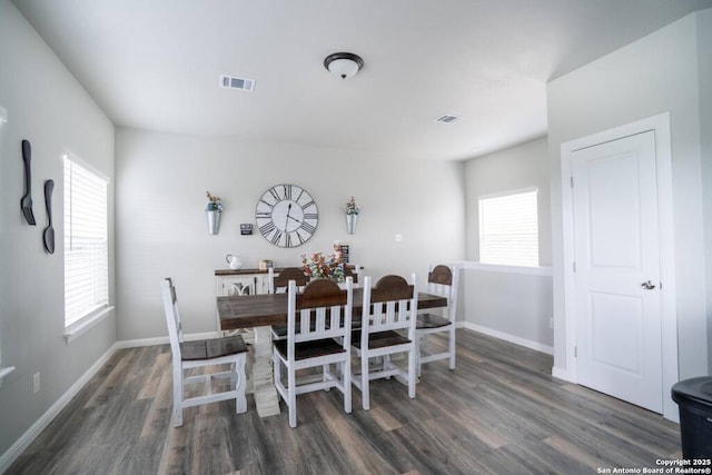 239 Damar Cv, Canyon Lake, TX 78133 - dining space with wood finished floors, plenty of natural light, and baseboards