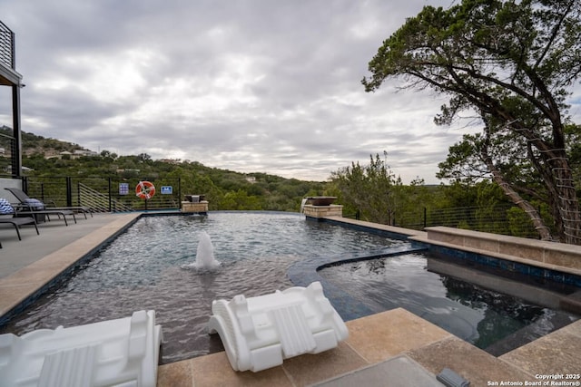 239 Damar Cv, Canyon Lake, TX 78133 - view of swimming pool featuring a pool with connected hot tub