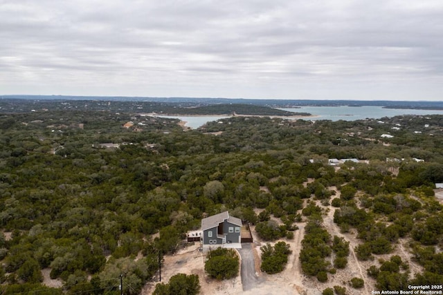 239 Damar Cv, Canyon Lake, TX 78133 - drone / aerial view of a heavily wooded area and a large body of water