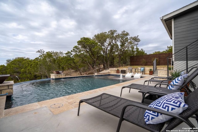 239 Damar Cv, Canyon Lake, TX 78133 - outdoor pool featuring a patio