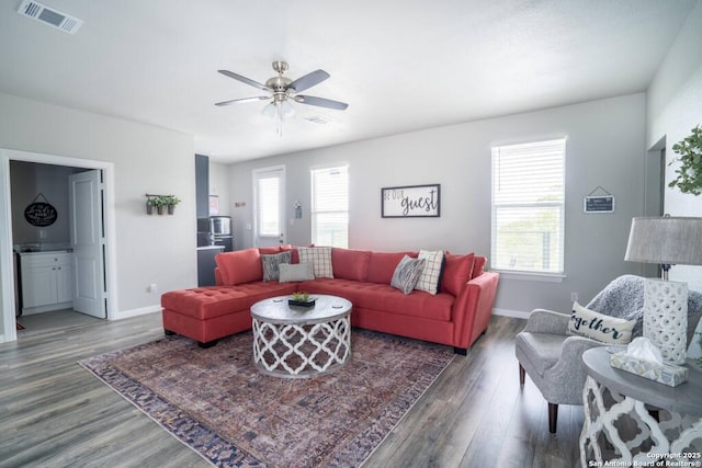 239 Damar Cv, Canyon Lake, TX 78133 - living room featuring wood finished floors, baseboards, and a ceiling fan