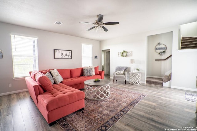 239 Damar Cv, Canyon Lake, TX 78133 - living room with stairway, wood finished floors, a ceiling fan, and baseboards