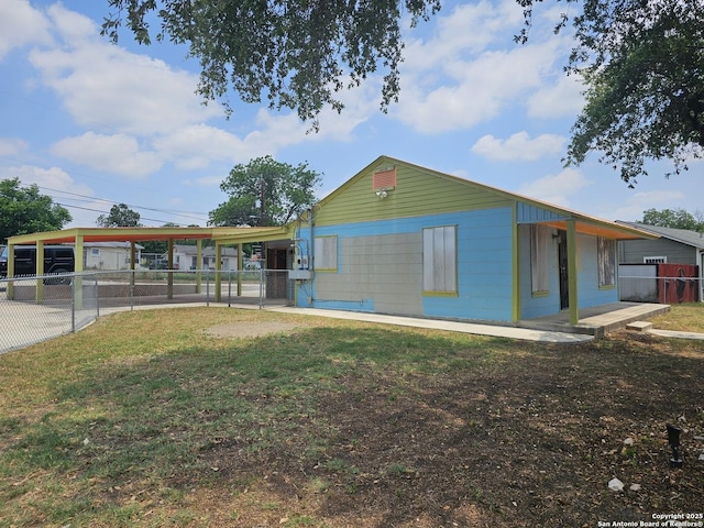 303 Cravens, San Antonio, TX 78223 - view of side of home featuring a carport