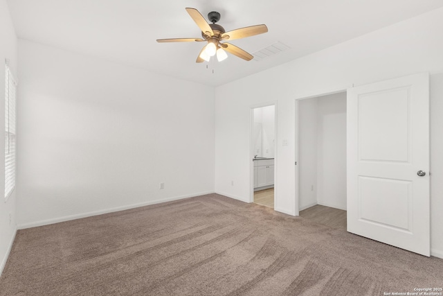 31908 Native Sun, Bulverde, TX 78163 - unfurnished bedroom with light colored carpet, baseboards, ensuite bathroom, and ceiling fan