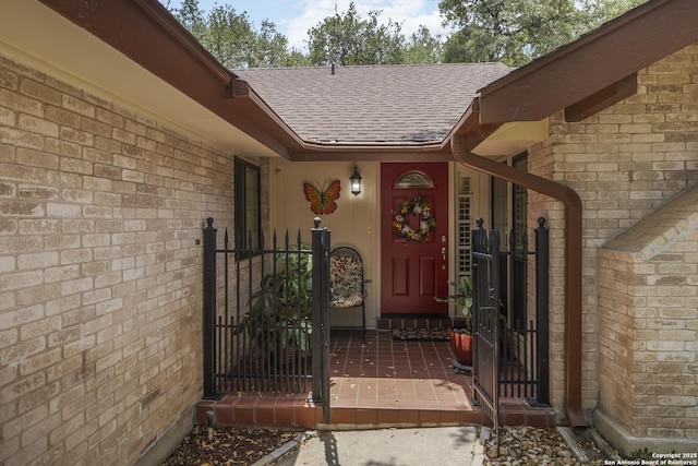 4722 Paradise Woods, San Antonio, TX 78249 - entrance to property with roof with shingles, a gate, and brick siding