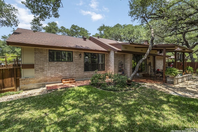 4722 Paradise Woods, San Antonio, TX 78249 - back of house featuring a patio, brick siding, and roof with shingles