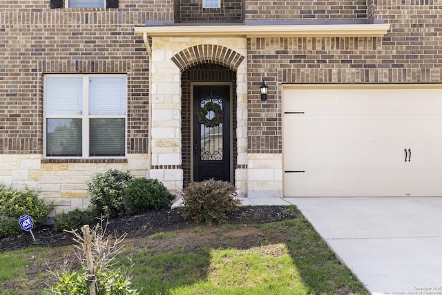 313 Canon Hill, Spring Branch, TX 78070 - view of exterior entry with brick siding, concrete driveway, and stone siding