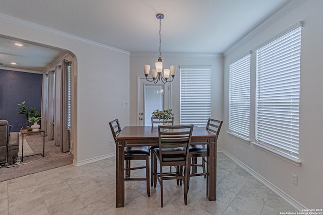 15166 Orpheus Way, San Antonio, TX 78245 - dining room with a chandelier, plenty of natural light, ornamental molding, baseboards, and arched walkways