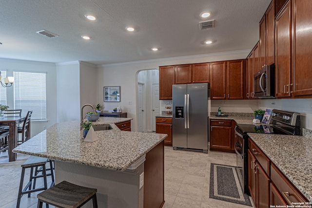 15166 Orpheus Way, San Antonio, TX 78245 - kitchen with stainless steel appliances, a sink, crown molding, arched walkways, and a kitchen bar