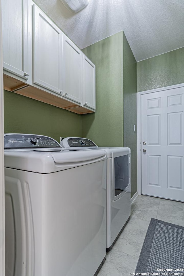 15166 Orpheus Way, San Antonio, TX 78245 - laundry room with cabinet space, separate washer and dryer, and a textured wall