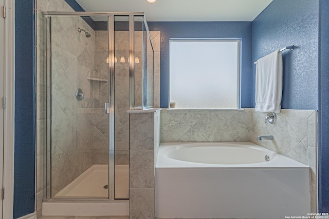 15166 Orpheus Way, San Antonio, TX 78245 - bathroom with a bath and a stall shower