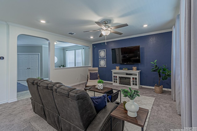 15166 Orpheus Way, San Antonio, TX 78245 - living area featuring carpet, a ceiling fan, crown molding, arched walkways, and baseboards