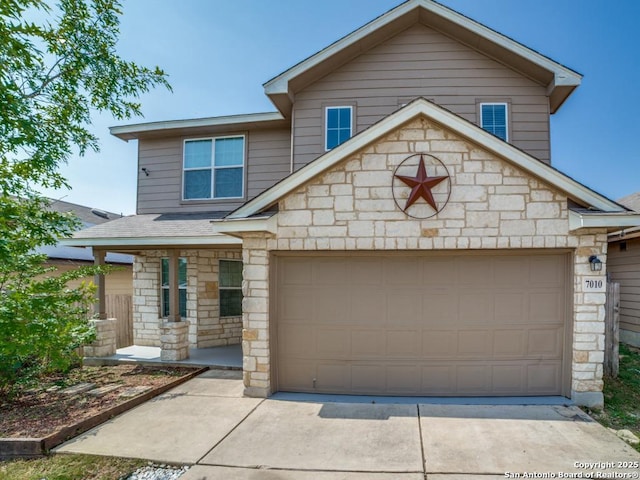7010 Aphrodite Mist, San Antonio, TX 78252 - traditional home with stone siding, an attached garage, and driveway