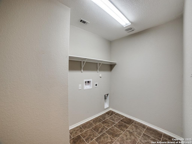 7010 Aphrodite Mist, San Antonio, TX 78252 - laundry room featuring hookup for a gas dryer, electric dryer hookup, hookup for a washing machine, baseboards, and a textured ceiling