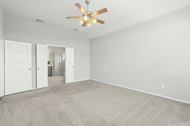 9304 Aggie Run, San Antonio, TX 78254 - unfurnished bedroom featuring carpet floors, baseboards, ceiling fan, lofted ceiling, and ensuite bath