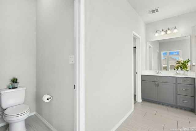 9304 Aggie Run, San Antonio, TX 78254 - bathroom with vanity, toilet, and baseboards