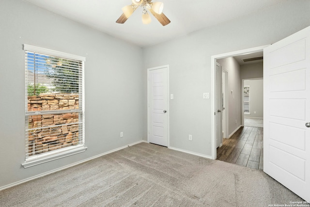9304 Aggie Run, San Antonio, TX 78254 - unfurnished bedroom with carpet flooring, baseboards, and a ceiling fan