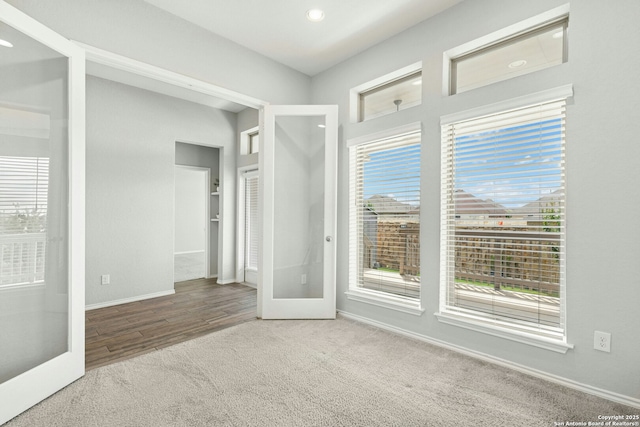 9304 Aggie Run, San Antonio, TX 78254 - carpeted spare room with baseboards, recessed lighting, and wood finished floors