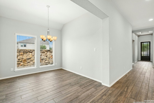 9304 Aggie Run, San Antonio, TX 78254 - unfurnished dining area with a chandelier, dark wood-style floors, and baseboards
