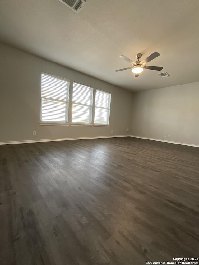2606 Montebello, San Antonio, TX 78259 - spare room with dark wood finished floors, baseboards, and a ceiling fan