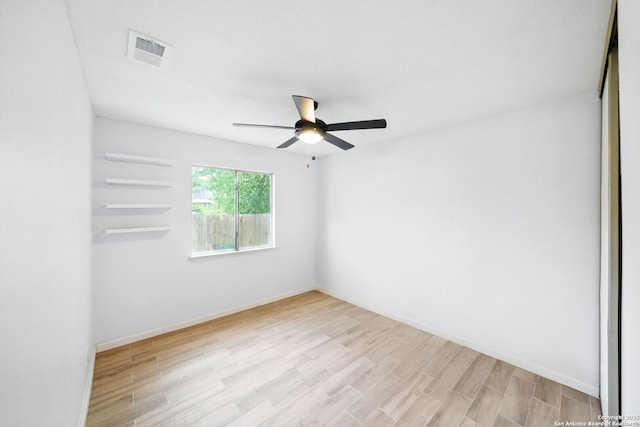14201 Modesta Pl, San Antonio, TX 78247 - spare room featuring light wood-type flooring, ceiling fan, and baseboards