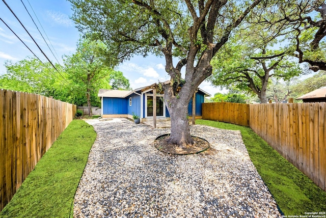 14201 Modesta Pl, San Antonio, TX 78247 - view of front facade featuring a fenced backyard and board and batten siding